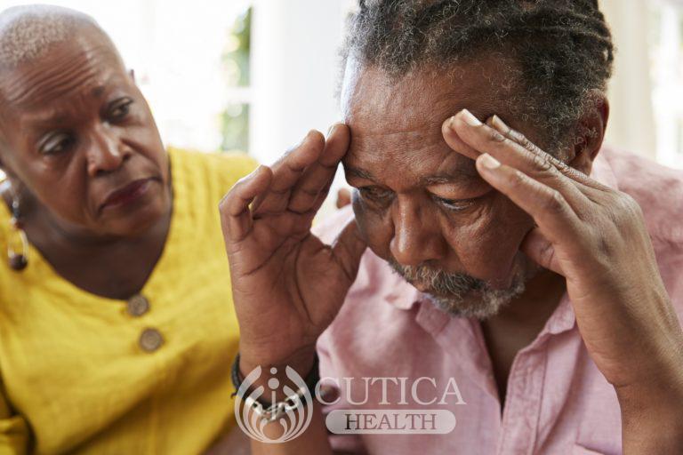 senior-woman-comforting-man-with-depression-at-P6866K3-768x512-3